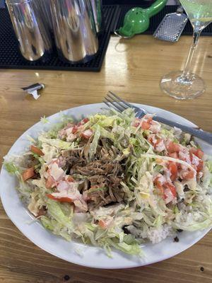 Forgot the name but it was pulled pork with black beans and rice and then you had kinda like salad on top with the sauce.