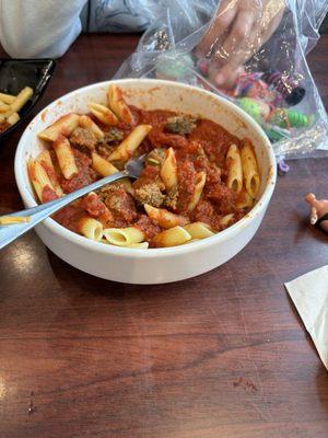 Penne pasta with meatballs.