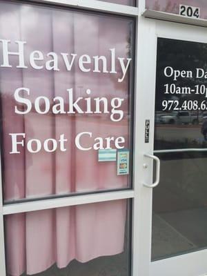 The name of the place is in the window. Their main sign just reads "Foot Massage"