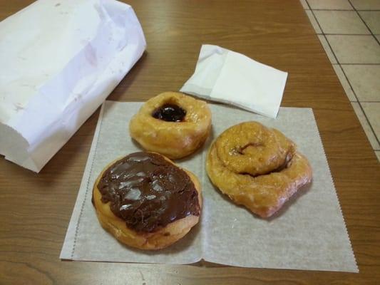 Strawberry filled, cinnamon roll and a eclair donuts.  All great, wish I could eat one of every donut they make.