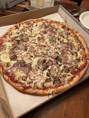 Large pizza with mushrooms and onions