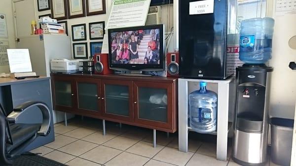 Waiting area, free soda or juice, water and tv