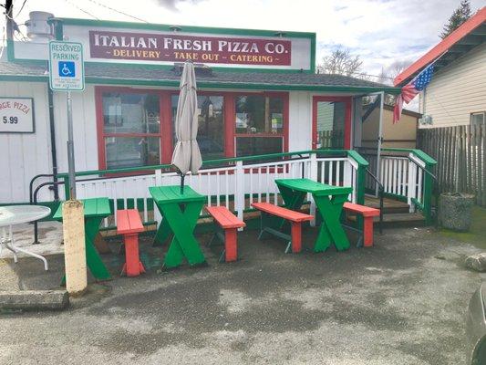 Outdoor benches and parking out front