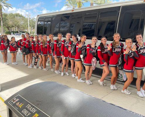 Happy cheerleaders getting dropped of at destination by ibex Town Car Mini Bus.