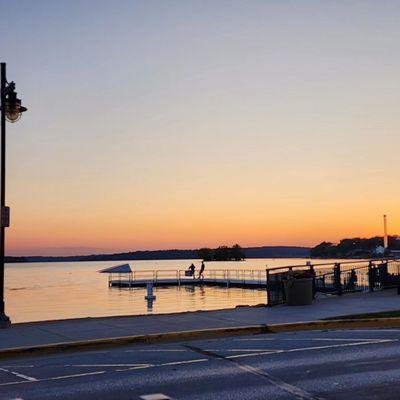 Sun setting over Pewaukee Lake across the street