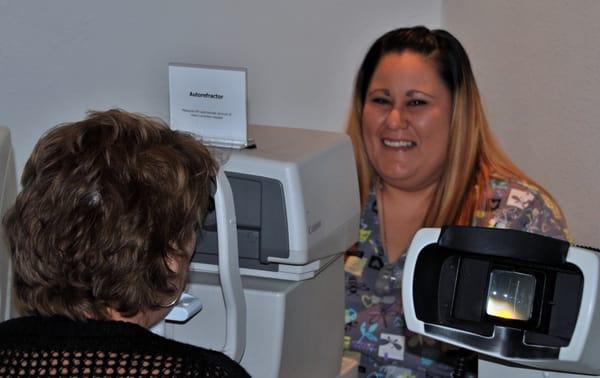 Mandy working with a patient on the Autorefractor