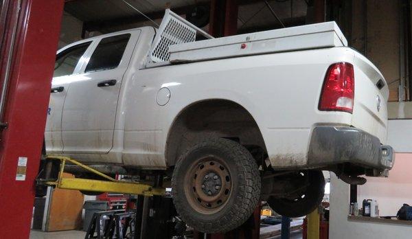 Truck on lifters in our repair in our shop.