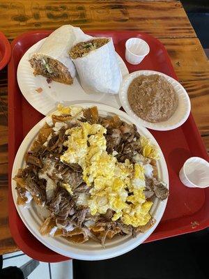 Chilaquiles Rojas with scrambled eggs and side of beans, Carnitas Burrito