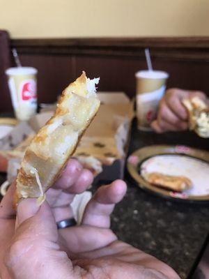 Uncooked cheese bread, scared to eat much because it might make us sick.