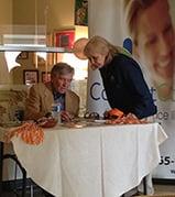 Company Spokesman Coach Johnny Majors signs autographs at Senior Center.