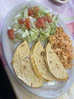 Corn quesadillas with plain cheese and apparently a dry salad?