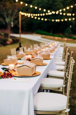 Bridal shower table with each individually boxed sword and skillet meal