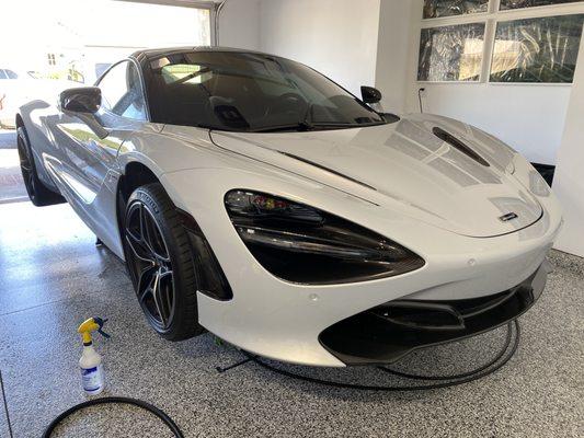 McLaren 720S receiving XPEL Ultimate Plus, paint protection film installation to carbon fiber pieces