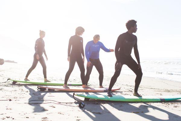 Learn the fundamentals of surfing on the land before entering the water!