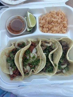 4 tacos with a side of rice. 2 al pastor and 2 carne asada.