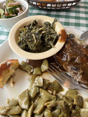 Hamburger steak, green beans, turnip greens, corn bread, and cucumber salad.