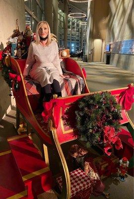 Photos in Santa's sleigh at https://www.denvercenter.org.