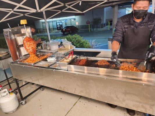 Friendly chef grilling up fresh meat.