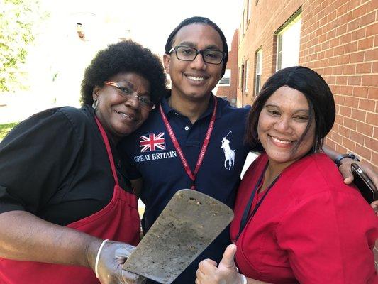 Staff, grilling food for residents on National Nursing Home Week