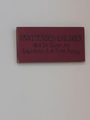 Unattended children will be given an Expresso and a free puppy   Such a cute sign