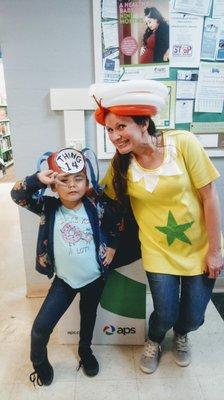 Library manager dressed like a Star Belly Sneech for Dr Seuss 5 year annual birthday party. 5 year old Azmiee Fisher poses with Tracy .