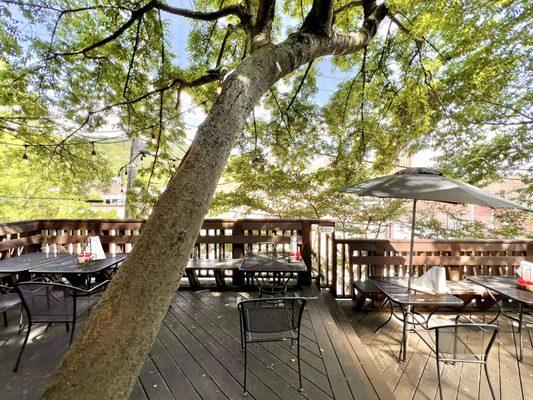 Outdoor patio space with trees for shade.