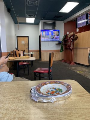 Restaurant inside with plates still on tables