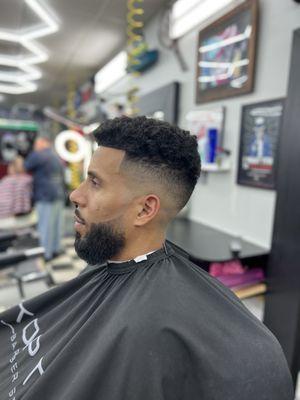 Mid/High Skin Fade 
Beard/Line Up And Enhancements