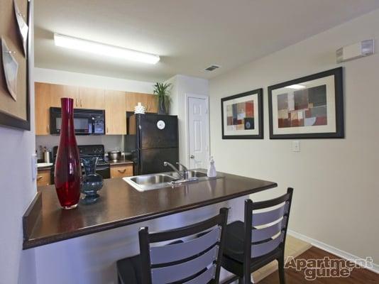 The apartment kitchens are fully stocked with black appliances, pantries, granite counter-tops, and tile flooring!