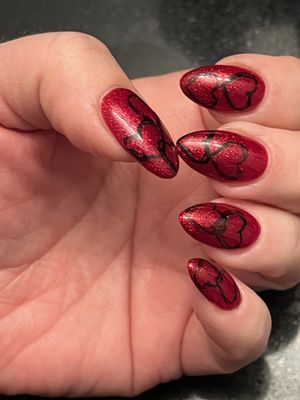 Beautiful, Valentine gel nails  black hearts on sparkly red nail polish