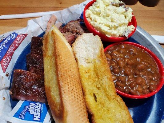 Pork and rib plate with potato salad and beans