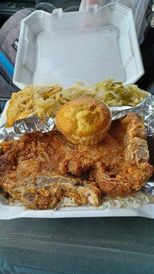 Sweet baby Jesus. Fried pork chops, rice and gravy, fried cabbage, cheesy broccoli and rice and cornbread.