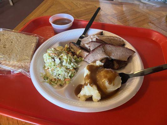 Two 2 Meat Combo Plate  Ribs, brisket, coleslaw, and mashed potatoes. Came with two slices of white bread.   With a tea and tip $26