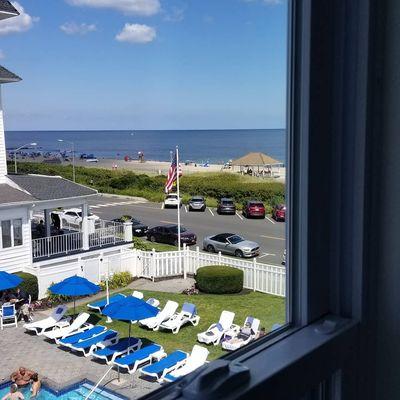 View.  Neighboring hotels pool and a little ocean.