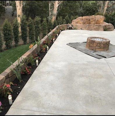 Full backyard re landscaping. With fire pit and waterfall features.