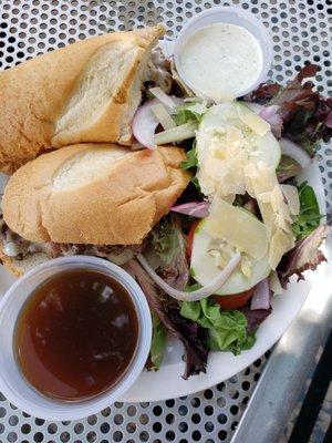 au jus steak sandwich with salad