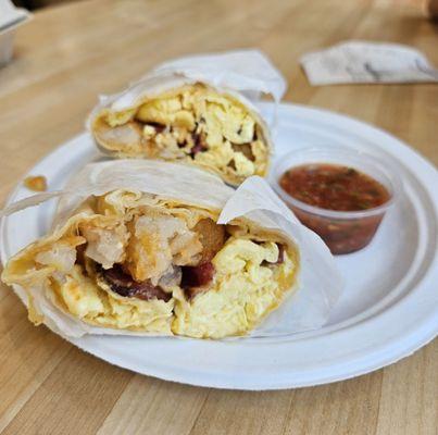 Breakfast burrito with salsa.