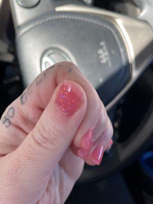 Nail tip uneven and color not covering the whole nail.