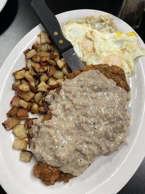 Country fried steak with breakfast potatoes