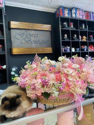 Beautiful basket with different shades of pink blooms.