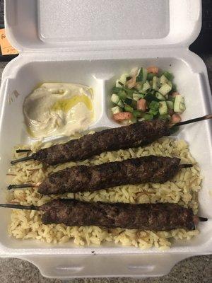 Kofta kabob with rice and side hummus and salad