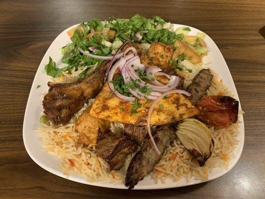 Beef, chicken, kefta kabobs with lamb chop, rice, salad, veg, bread.