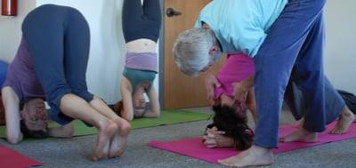 Ti assisting headstand.