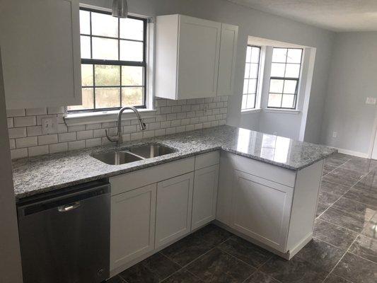 Brand new countertops, sink, cabinets, dishwasher, floor