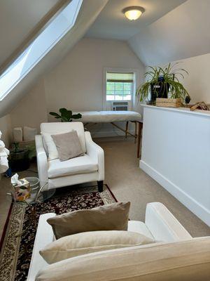 My space is in the atrium/loft of an old farm house. It is quiet, comfortable, and private.