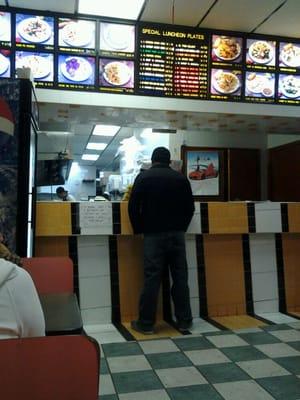 Counter service and four booths for eat in dining