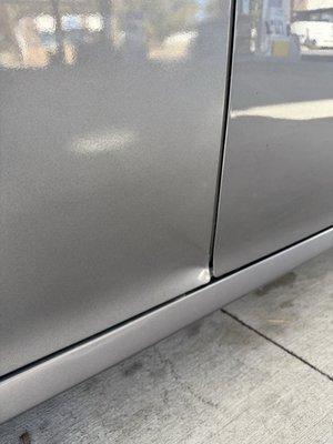 Dent on the bottom of the door. I did say it was okay at first but lighting was different in the shop... very noticeable now.