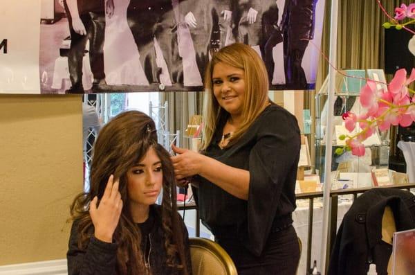 Quinceañera's Hair and updos been done by the kairos team at the Quinceañera expo.