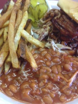 Small barbecue plate with baked beans and fresh cut French Fries.