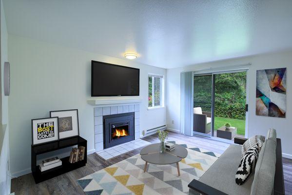 Living room with sliding glass door to large private deck or patio.